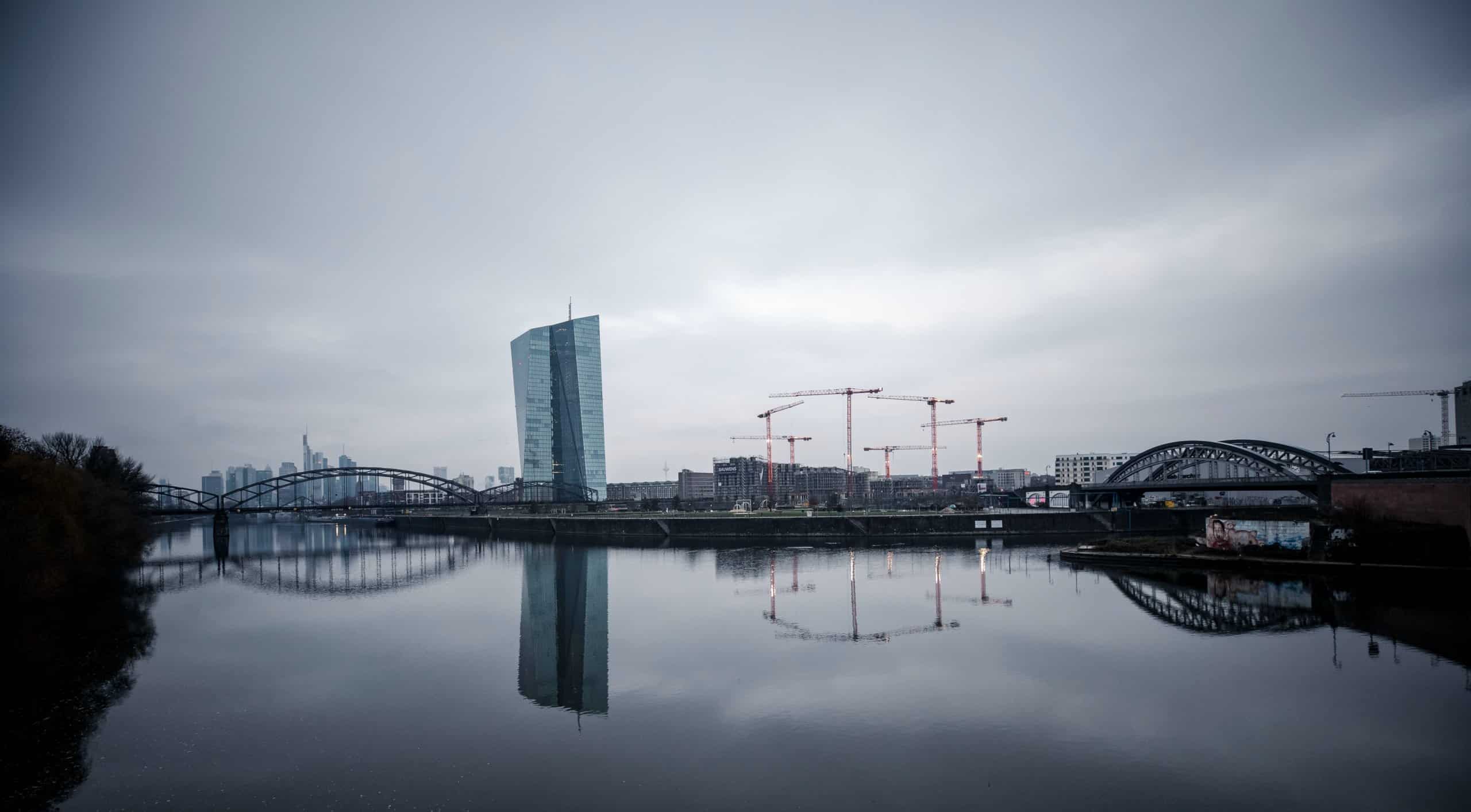 body of water near city buildings during daytime