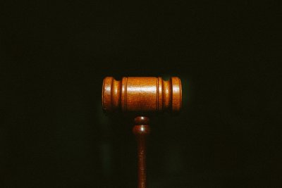 brown wooden stand with black background