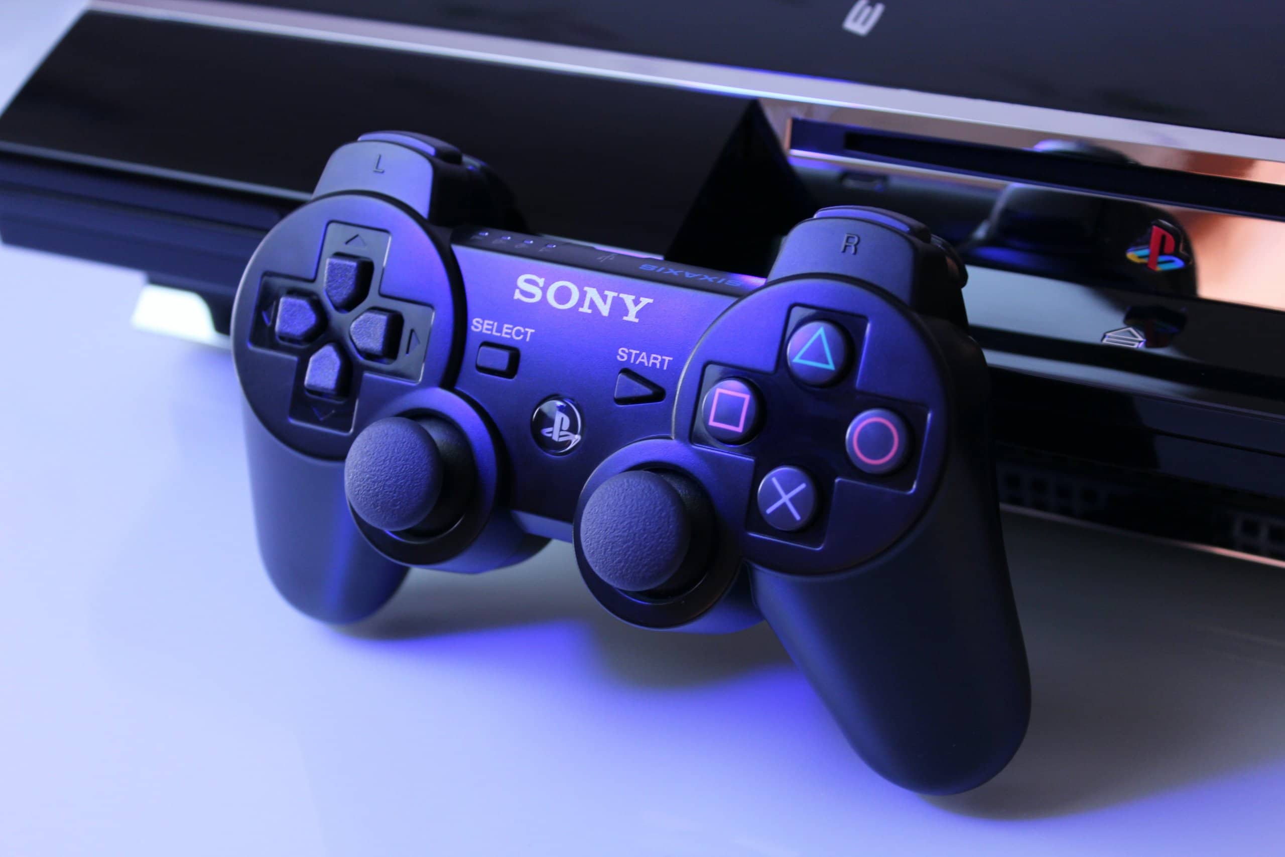 black Sony PS2 controller on white surface