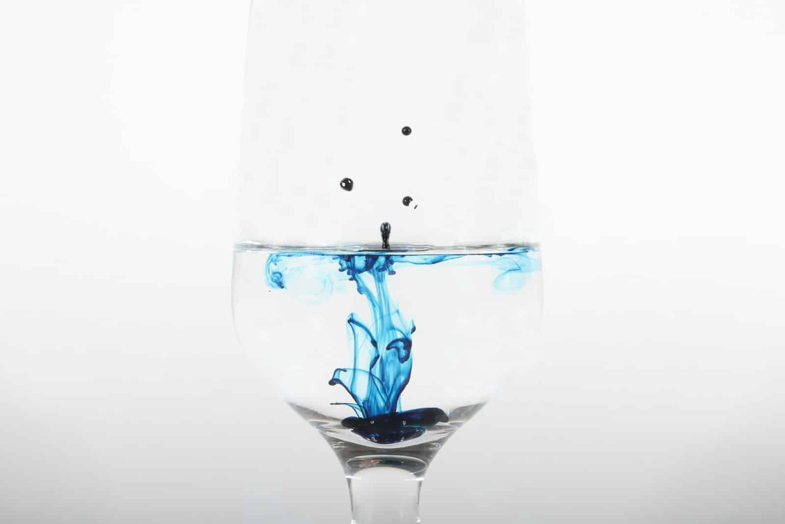 clear glass with blue ink dropped illustration