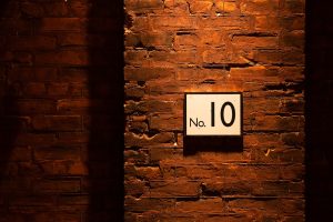 no. 10 sign on brick wall
