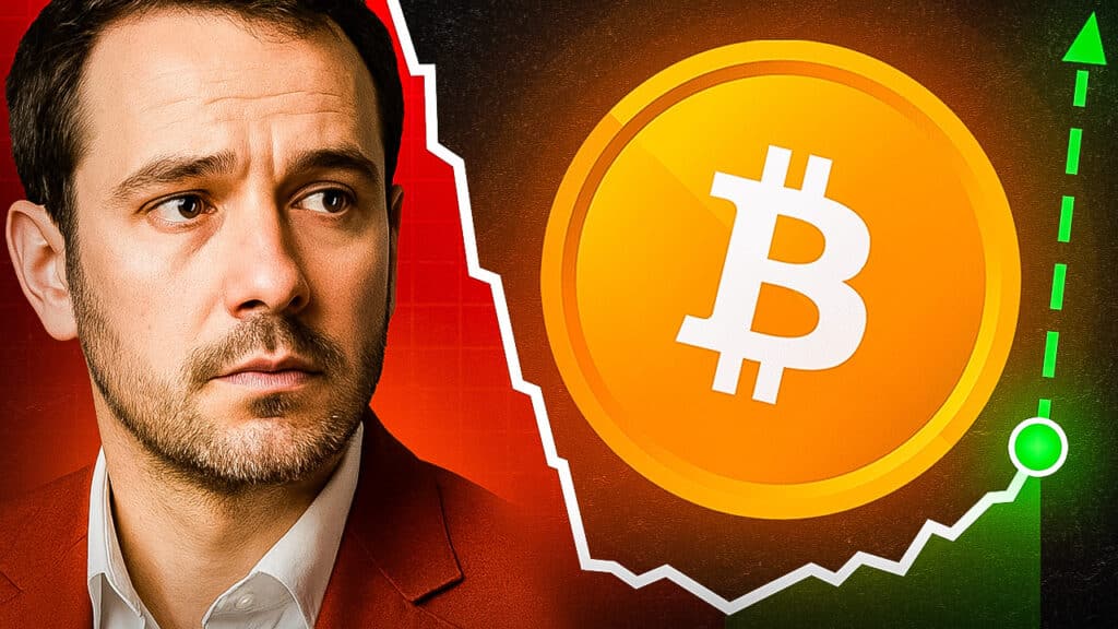 Ein nachdenklich blickender Mann in rotem Anzug steht vor einem großen Bitcoin-Symbol. Im Hintergrund ist eine grün-rote Kurslinie zu sehen, die an einen möglichen Auf- und Abschwung erinnert. Darüber steht die leuchtende Zahl „2026?“ – Symbol für Spekulationen über die Zukunft des Bitcoin-Marktes.