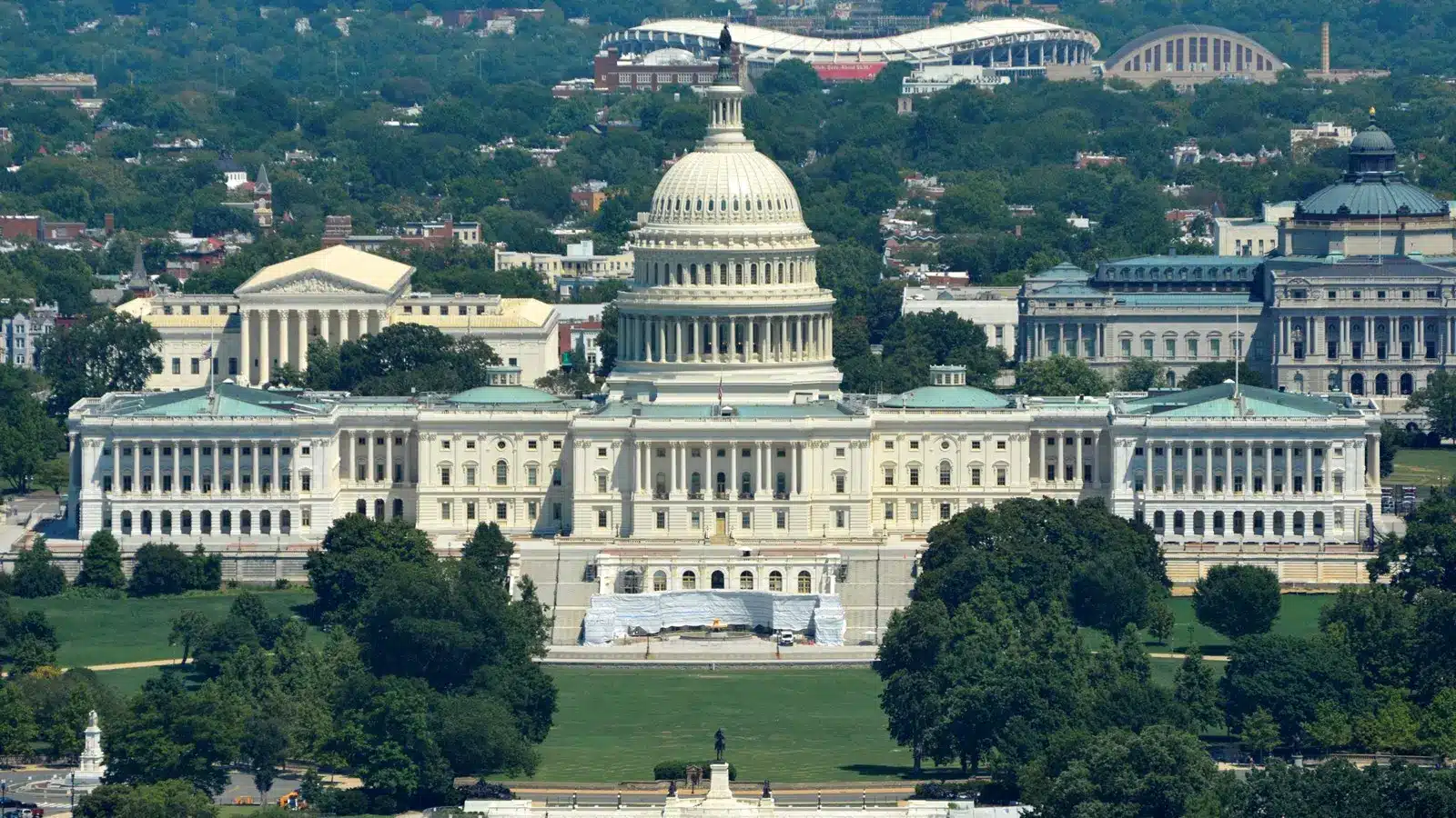 Wide aerial view of the United States Capitol building in Washington DC with its white dome and wings